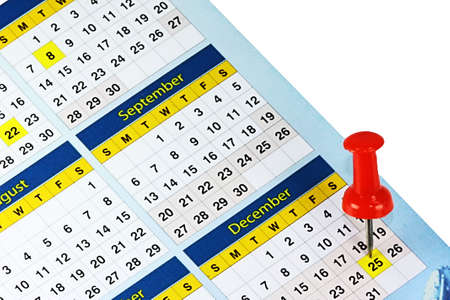 a calendar with red thumb tack on dateの写真素材