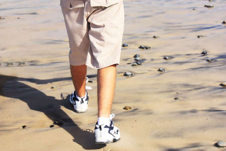 walking on the beach on a sunny dayの写真素材