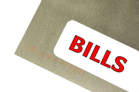 a recyled envelope a bill with a white backgroundの写真素材