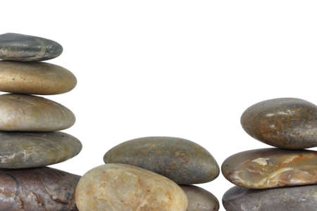 a pile of balancing rocks on white background