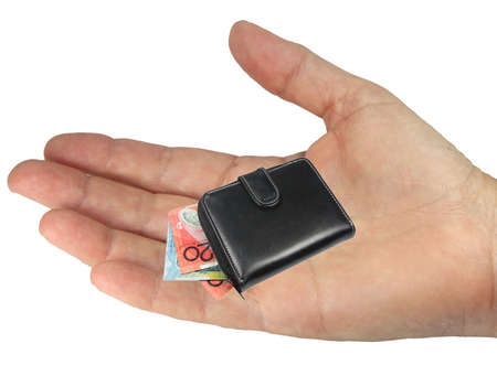 a hand holding a wallet and notes on white backgroundの写真素材