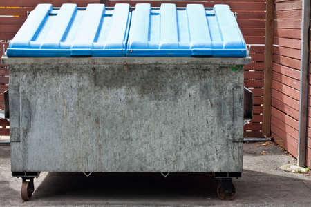 one recycle rubbish bin with closed blue lidの写真素材
