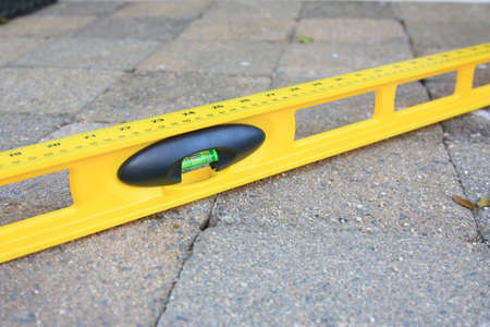 spirit level used to level the pavers or bricks