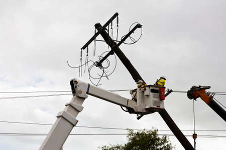 repair man fixing electricity poleの写真素材