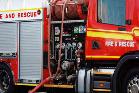 a close up of red fire engine and its equipment