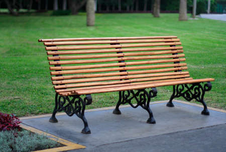a wooden bench seat at a park
