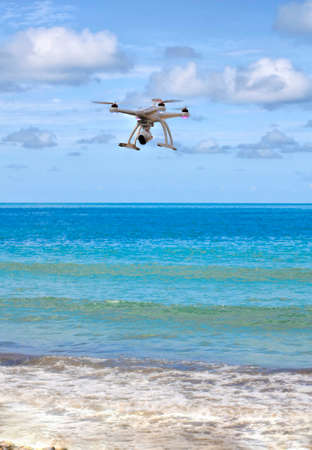 drone with camera  hovering over the seaの写真素材