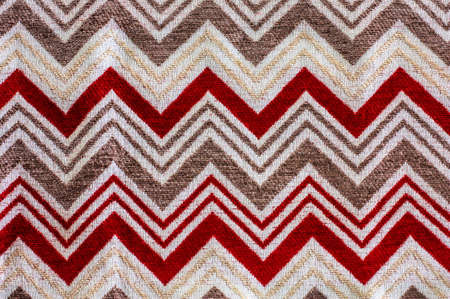 red colored fabric with zig zag patternの写真素材