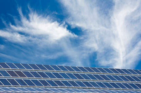 lots of solar panels on roof a;ternative energy