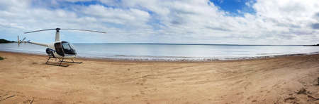 helicopter on the beach panoroma at Weipaの写真素材