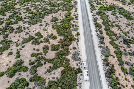 Aerial view of outback Australia and travelling with caravan and four wheel driveの写真素材
