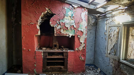 Very old cottage with old peeling paint on the walls