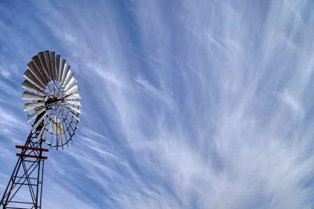 photo taken on a cloudy day with unusual clouds and windmill in the Northern Territoryの写真素材