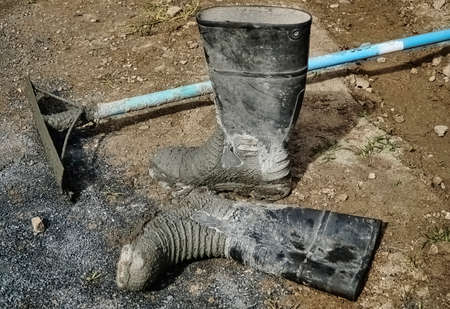 tools for doing concreting laying on the ground, old gum boots