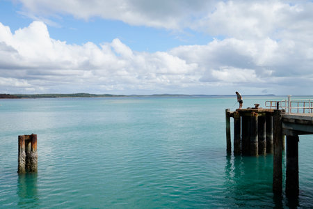 man fishing on the jetty at Seisia North Queenslandの写真素材