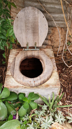 old outdoor toilet or Australian outdoor wooden dunny in the gardenの写真素材