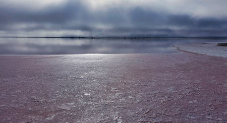 Victoria Australia largest inland salt lake. View of the lake and salt deposits on misty morning. Lake Tyrrell is a shallow, salt-crusted depression in the Mallee district of north-west Victoria, in Australia.の写真素材