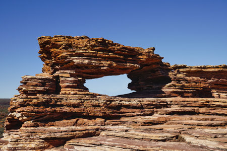Nature's Window is a wind-eroded opening in the layered sandstone that frames a view of the river down below. Australia, WA, Kalbarri National Park.の写真素材