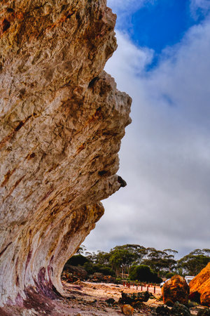 colorful bright orange and white rock formation in Western Australia. On the road between Noresman...