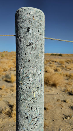 recycled fence post made from plastics, cardboard, and paper cups, making them suitable for harsh environmental conditions like those found near Lake Eyre. The posts are waterproof and rot-proof, making them ideal for the acidic or saline soils found in areas like Lake Eyre.の写真素材