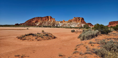 Rainbow Valley's colored rocks made up of sandstone bluffs and cliffs. They are part of the James Range located south of Alice Springs, Northern Territory in Australia.の写真素材