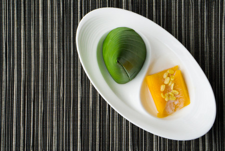 Thai Pyramid Dessert with Mango Sticky Rice on white plate