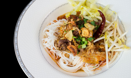 Thai White Noodle with Spicy Pork on White Plateの写真素材