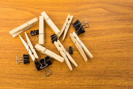 Group of Black Clip and Wood Clothespins with Random Patternの写真素材