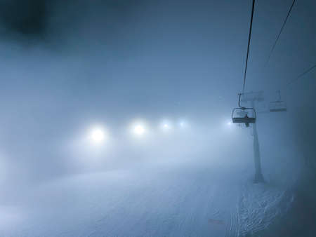 Ski slope in fog from ski lift