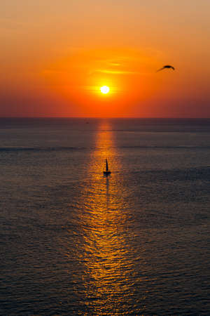 lonely boat in the sunsetの写真素材
