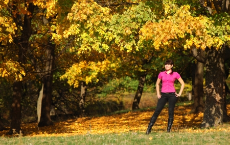 girl in a forest in autumn, wonderful golden timeの写真素材