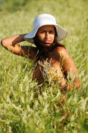 Girl on the beach, bright sun, good moodの写真素材