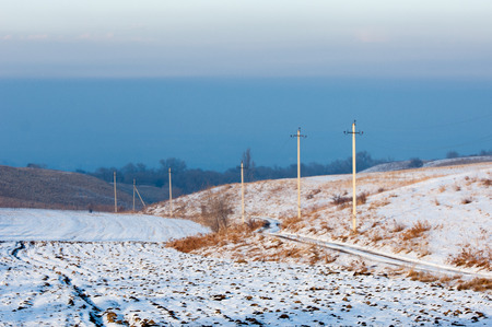 Power poles in the winter. Power linesの写真素材