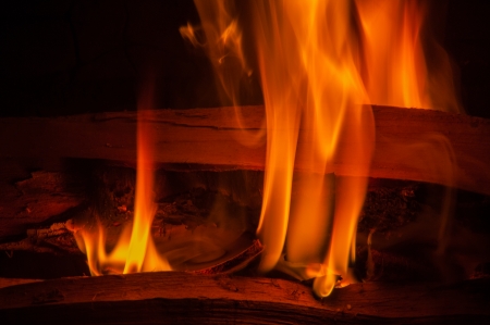 fire burning fire. Fire burning in the night. crest of flame on burning wood.blaze fire flame texture backgroundの写真素材