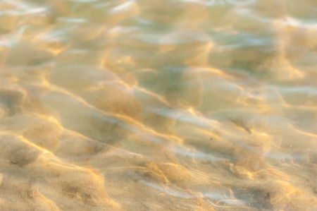  drawing in the sand on the tide. texture. beach sand background. footprints in the sand. の写真素材