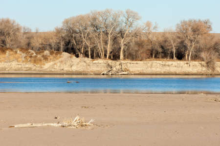 River in late autumn. A landscape photo in late autumn. sunrise over the river late autumn. winter landscape of southern Kazakhstanの写真素材