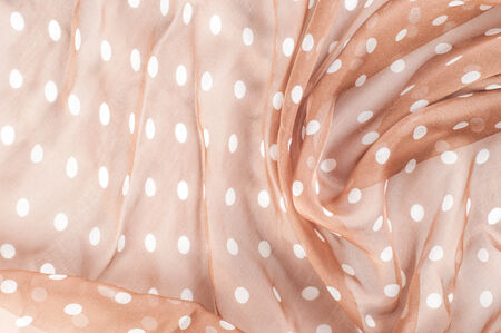 texture lace. a fine open fabric, typically one of cotton or silk, made by looping, twisting, or knitting thread in patterns and used especially for trimming garments.の写真素材