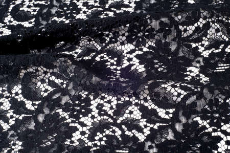 texture lace. a fine open fabric, typically one of cotton or silk, made by looping, twisting, or knitting thread in patterns and used especially for trimming garments.の写真素材