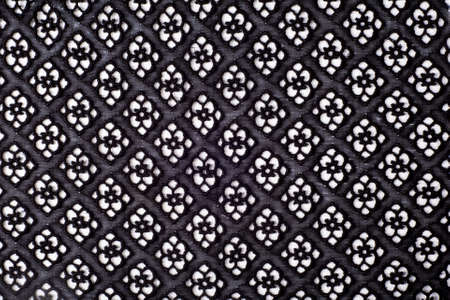 texture lace. a fine open fabric, typically one of cotton or silk, made by looping, twisting, or knitting thread in patterns and used especially for trimming garments.の写真素材