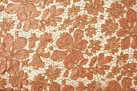 texture lace. a fine open fabric, typically one of cotton or silk, made by looping, twisting, or knitting thread in patterns and used especially for trimming garments.の写真素材