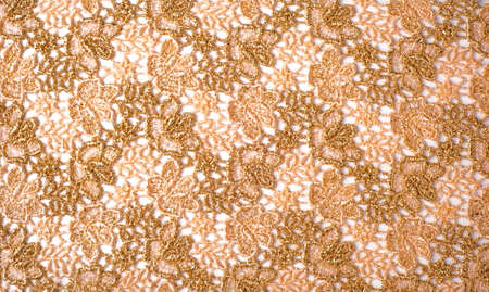 texture lace. a fine open fabric, typically one of cotton or silk, made by looping, twisting, or knitting thread in patterns and used especially for trimming garments.の写真素材