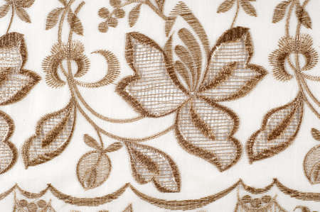 texture lace. a fine open fabric, typically one of cotton or silk, made by looping, twisting, or knitting thread in patterns and used especially for trimming garments.の写真素材