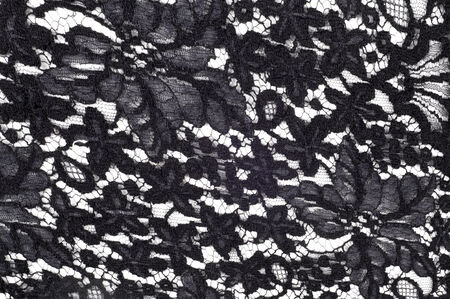 texture lace. a fine open fabric, typically one of cotton or silk, made by looping, twisting, or knitting thread in patterns and used especially for trimming garments.の写真素材