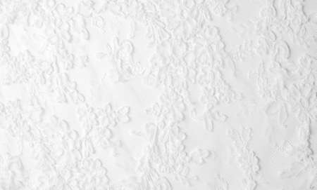 texture lace. a fine open fabric, typically one of cotton or silk, made by looping, twisting, or knitting thread in patterns and used especially for trimming garments.の写真素材