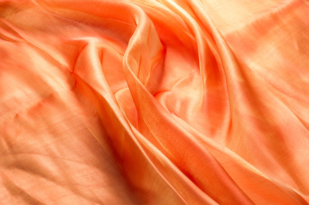 orange fabric texture. Tissue removed from the studio lightsの写真素材