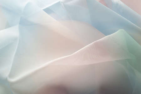 texture lace. a fine open fabric, typically one of cotton or silk, made by looping, twisting, or knitting thread in patterns and used especially for trimming garments.の写真素材