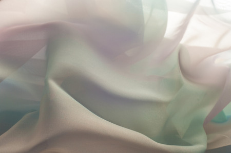 texture lace. a fine open fabric, typically one of cotton or silk, made by looping, twisting, or knitting thread in patterns and used especially for trimming garments.の写真素材