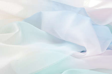 texture lace. a fine open fabric, typically one of cotton or silk, made by looping, twisting, or knitting thread in patterns and used especially for trimming garments.の写真素材