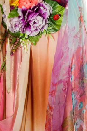 Pink fabric inlaid flowers. texture. Photographed in the studioの写真素材