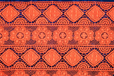 Red lace fabric texture Photo taken in the studio